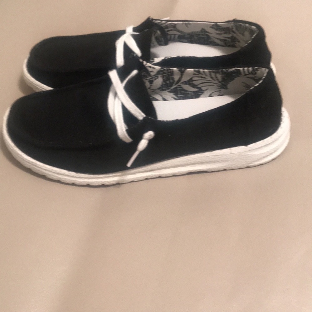 Women slip on canvas shoes.  Comfortable. In excellent condition